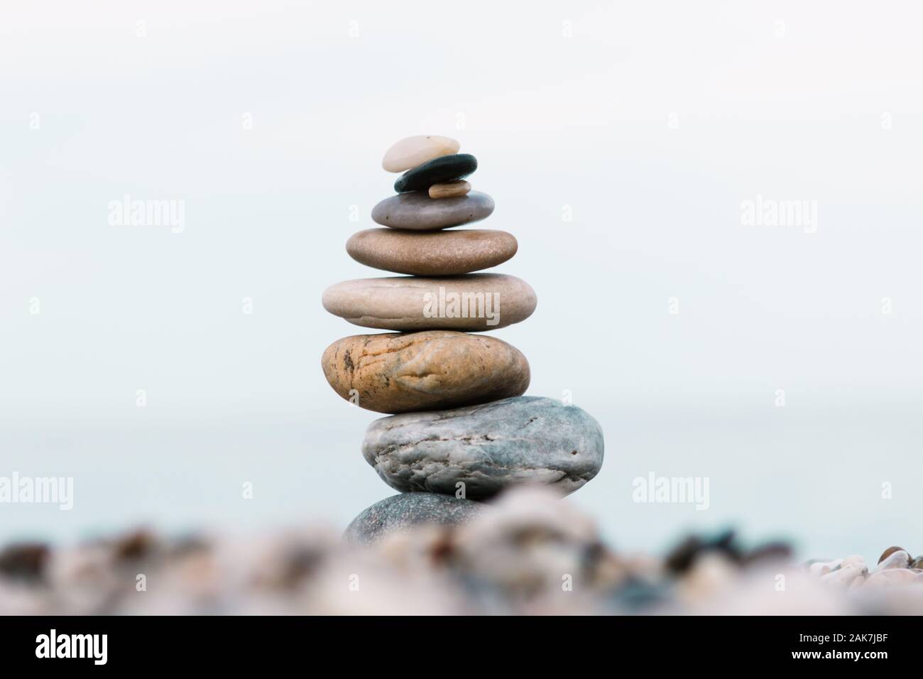 Wellness Stacking Rocks Spa and wellness background. Stack of pebble stones on the beach Stock ...