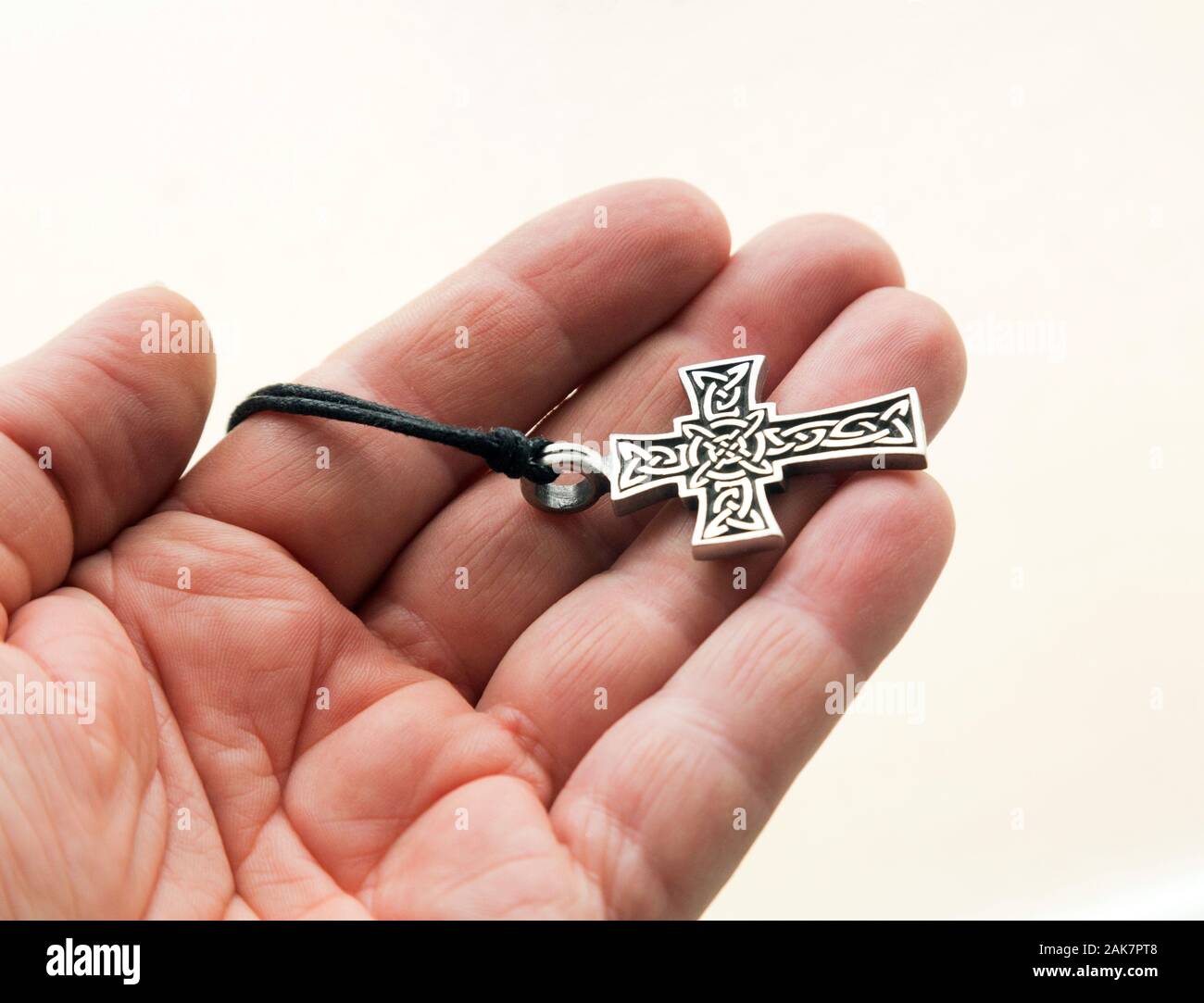 holding cross in hand Stock Photo