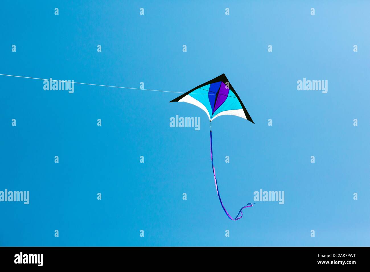 Kite flying high in the sky Stock Photo