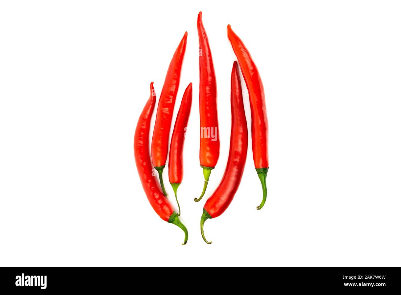 Red chili peppers in shape of fire isolated on white background Stock Photo