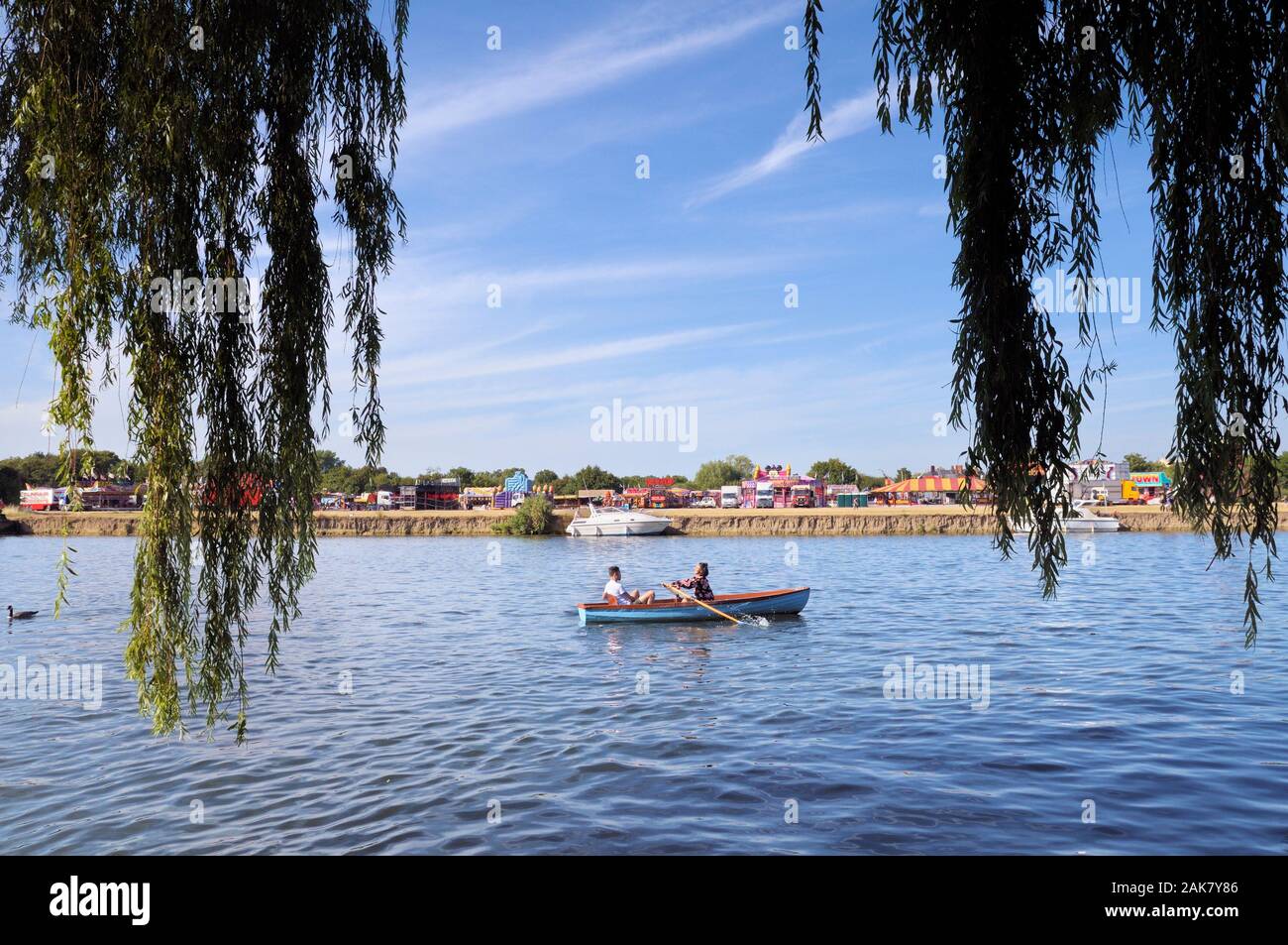 Young couple relaxing in a rowing boat on the River Thames at Windsor, Berkshire, England, UK Stock Photo