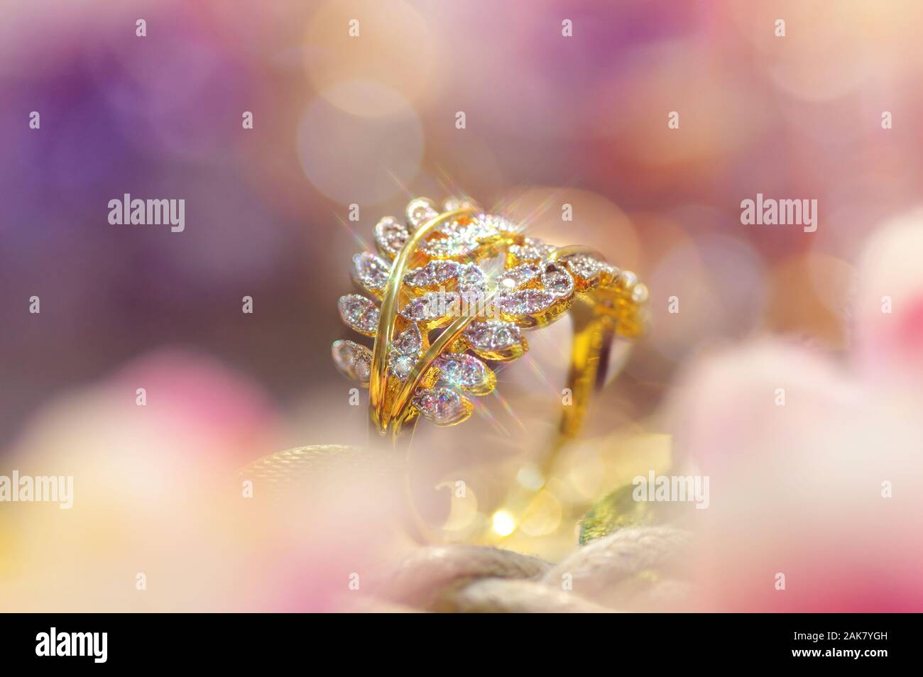 The gold and diamond engagement ring Stock Photo - Alamy
