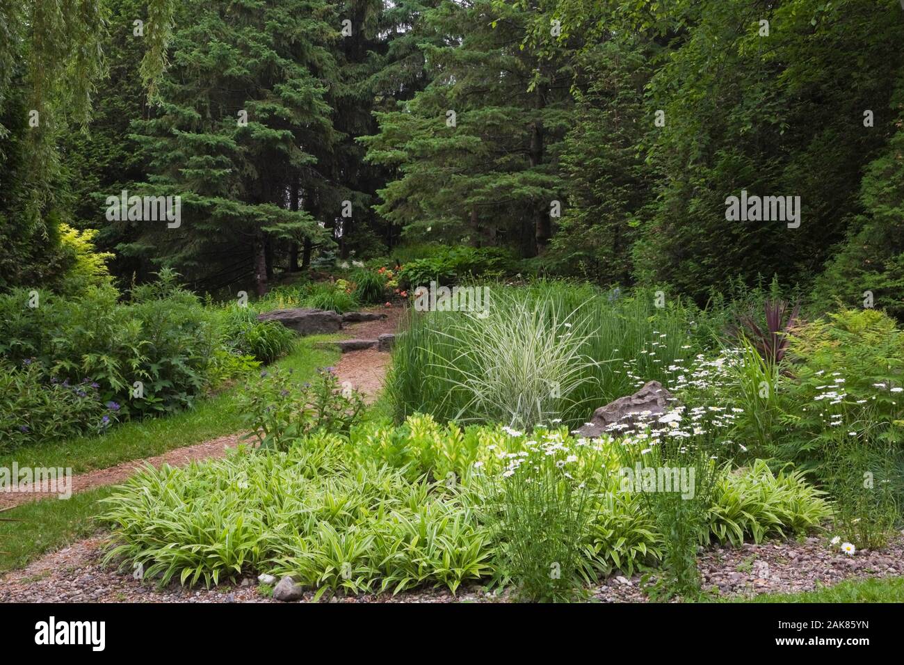 Walking path and flowers at springtime in a garden at the Centre de la
