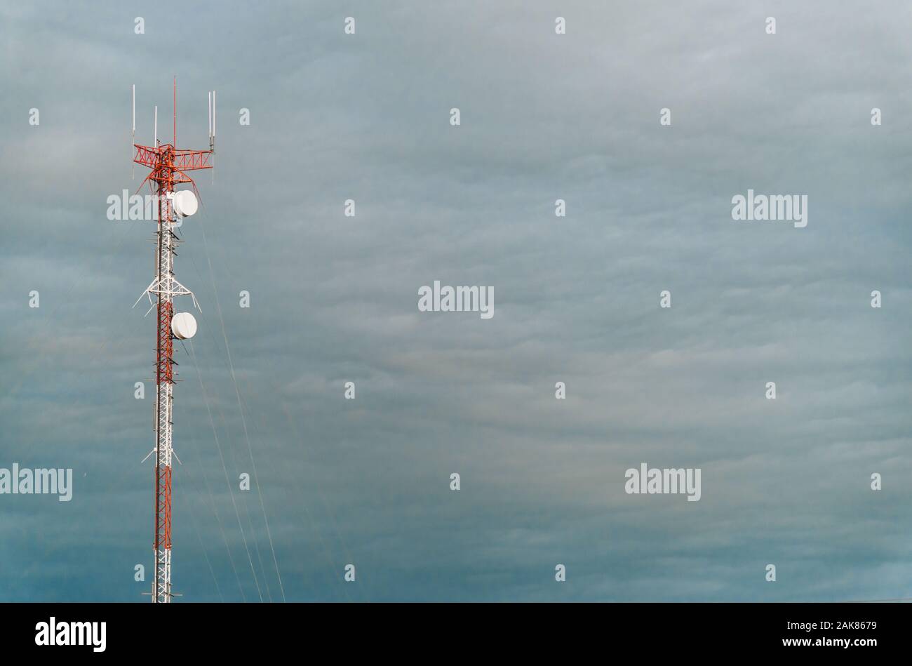 Colorful mobile phone network tower against blue sky Stock Photo Alamy