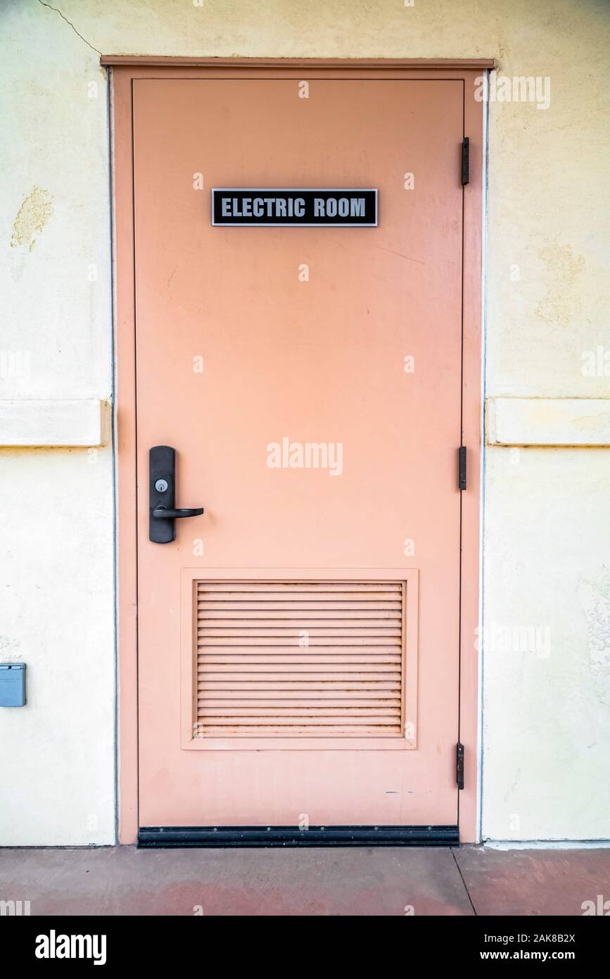 Door with Electric Room sign in the shade Stock Photo - Alamy