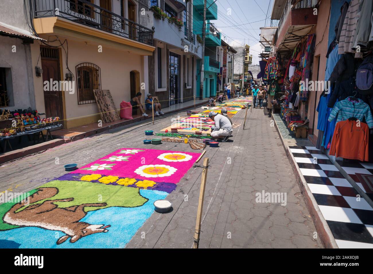 Santiago Atitlan, Guatemala - 30 March 2018: Local people making alfombra, colorful sawdust carpets for Semana Santa, Easter on the shopping street Stock Photo