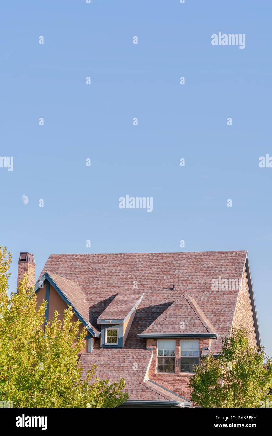 Steeply Pitched House Roof With Dormer Windows Stock Photo