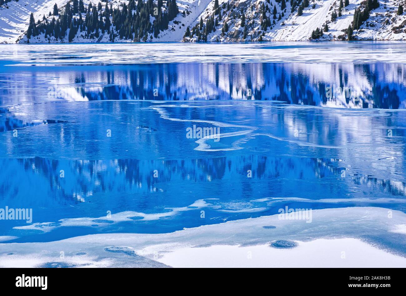 Bizarre forms of ice on a frozen mountain lake; variety of shapes in ...