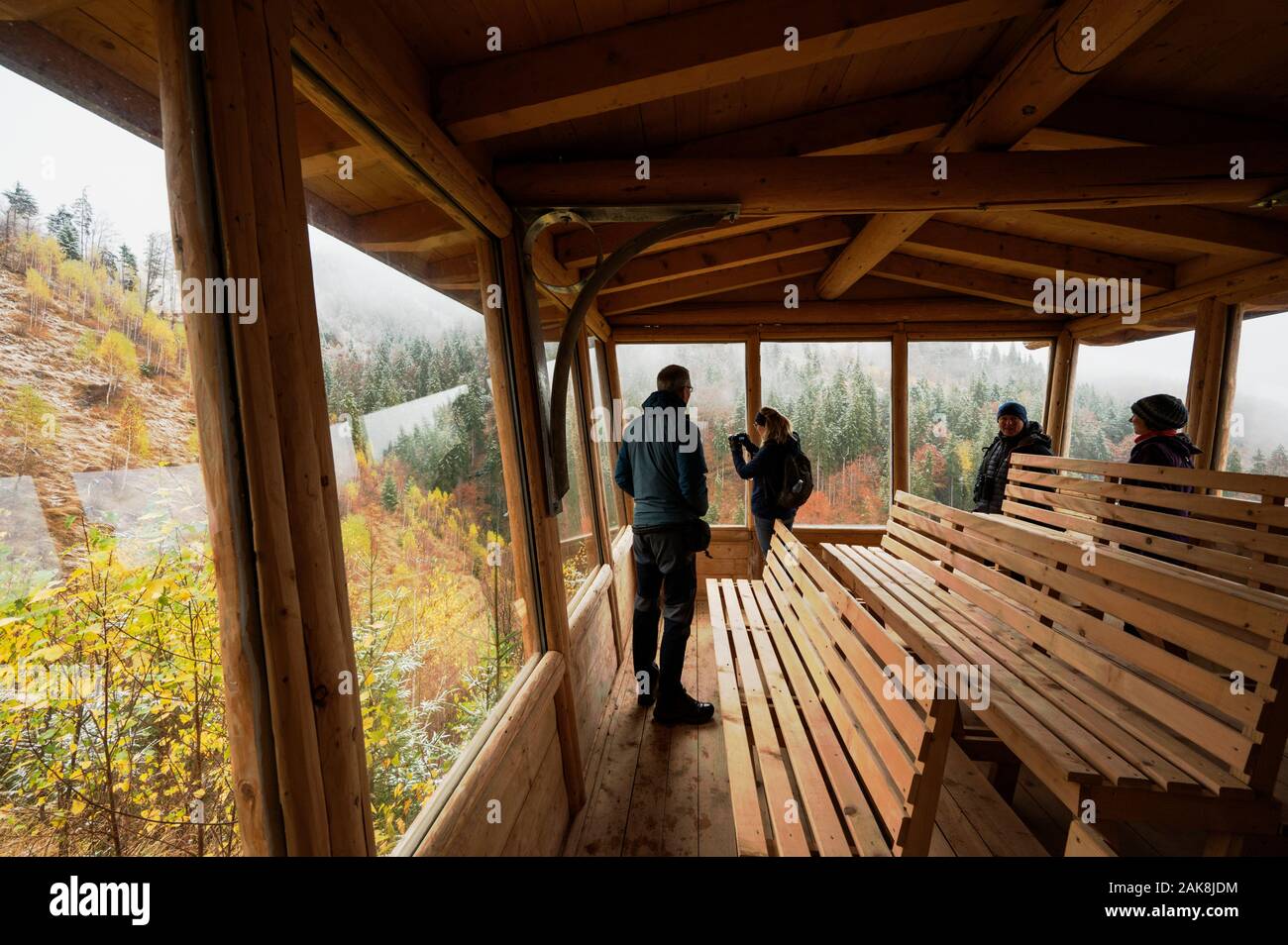 Visitors observing alpine conservation site at Draxin Carpathian Mountains Romania. Stock Photo