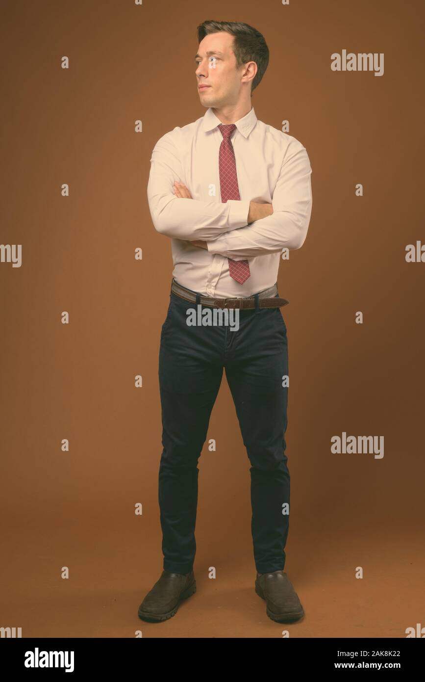 Full body shot of young handsome businessman Stock Photo - Alamy