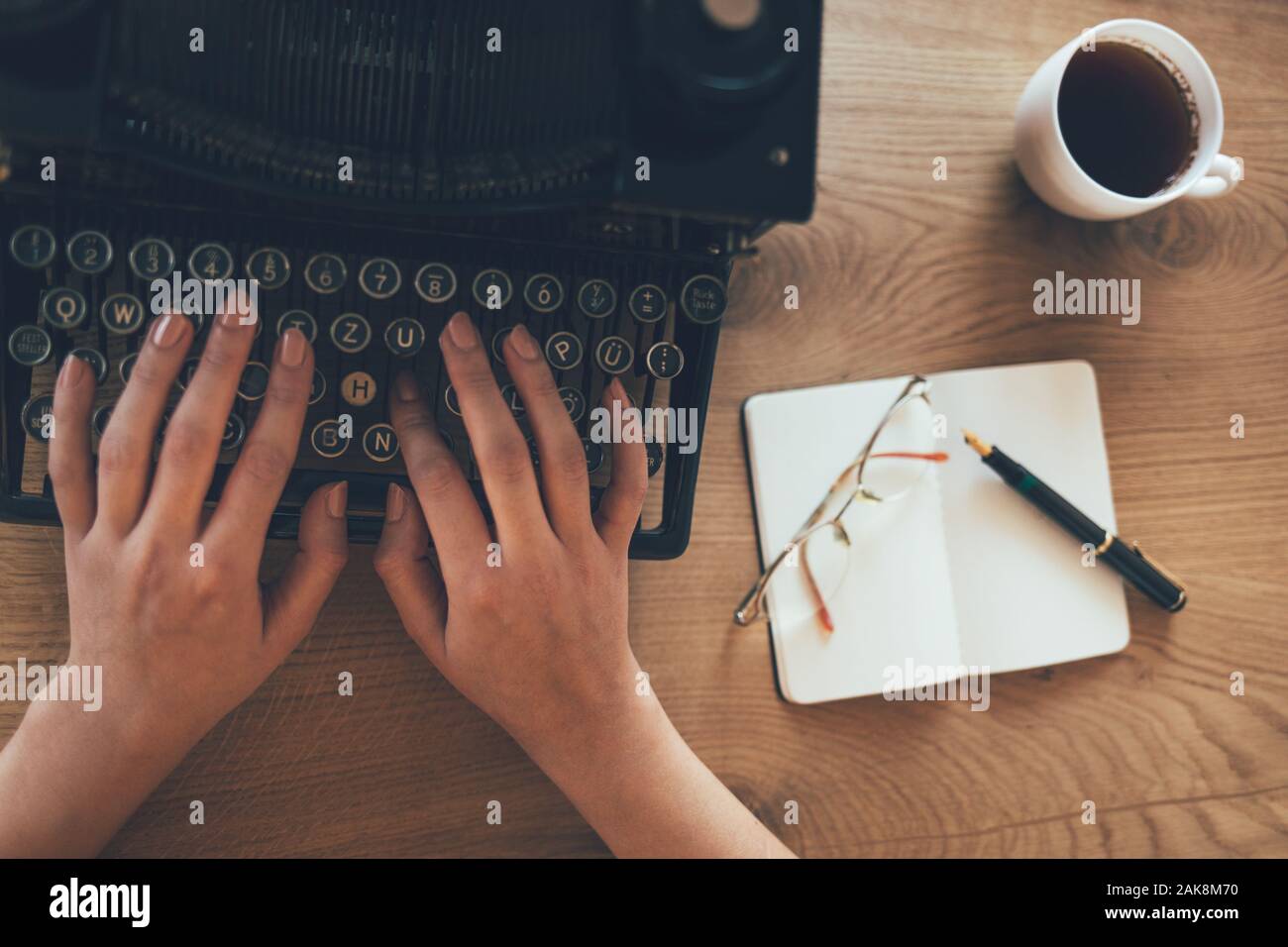 Close up of business woman hand working on office desk Stock Photo