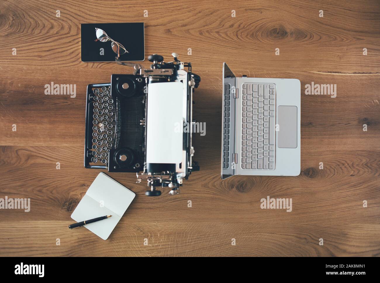 Typewriter vs laptop, old vs new Stock Photo Alamy