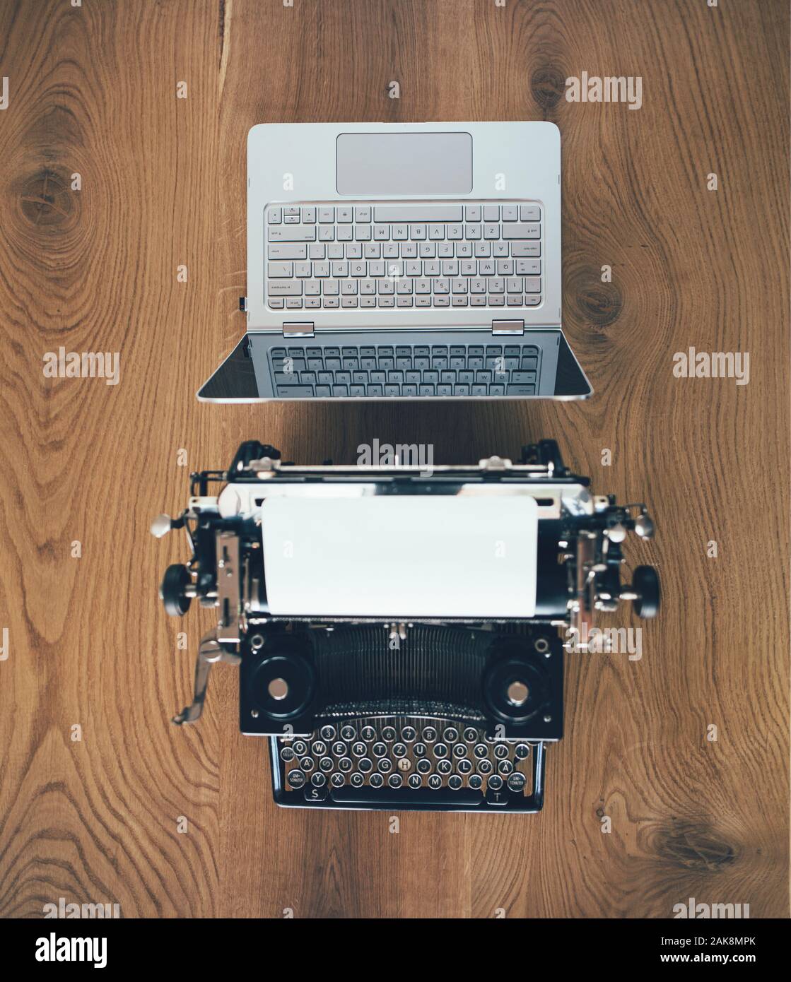 Typewriter vs laptop, old vs new Stock Photo Alamy