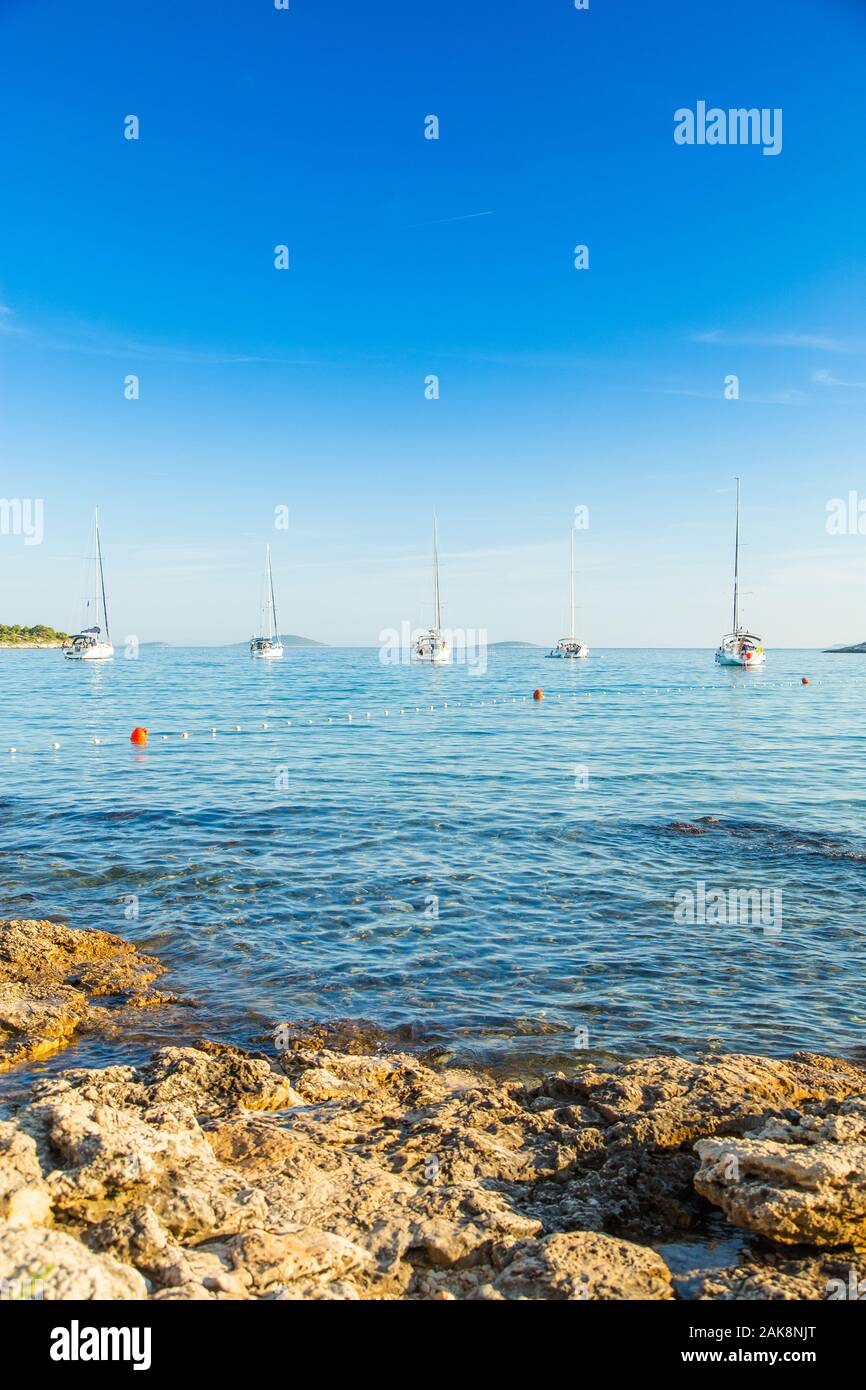 Beautiful Adriatic sea shore in Croatia, sailing boats in the morning
