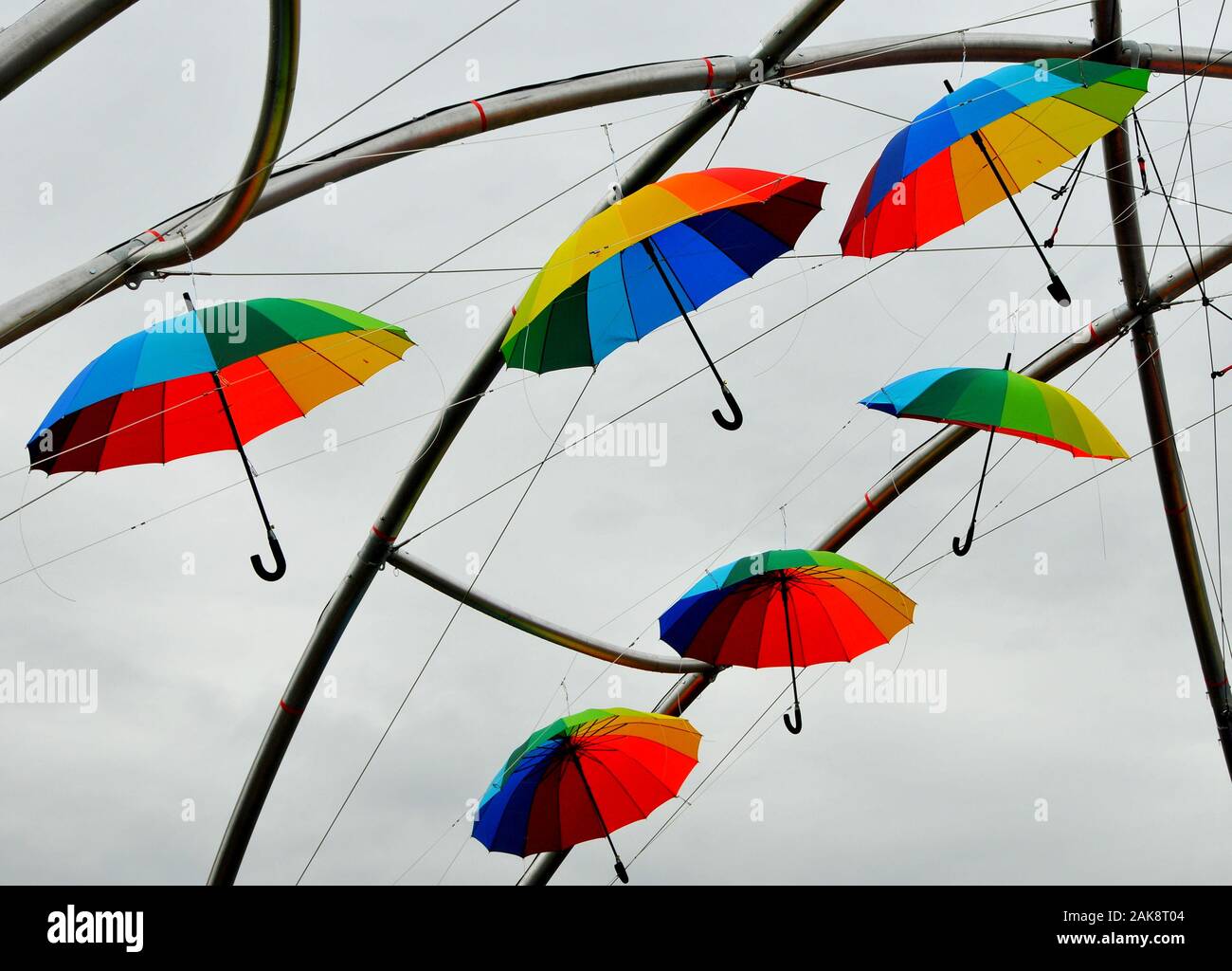 At the Cuba Dupa street fair 2018, umbrellas hang from scaffolding over central Wellington Stock Photo