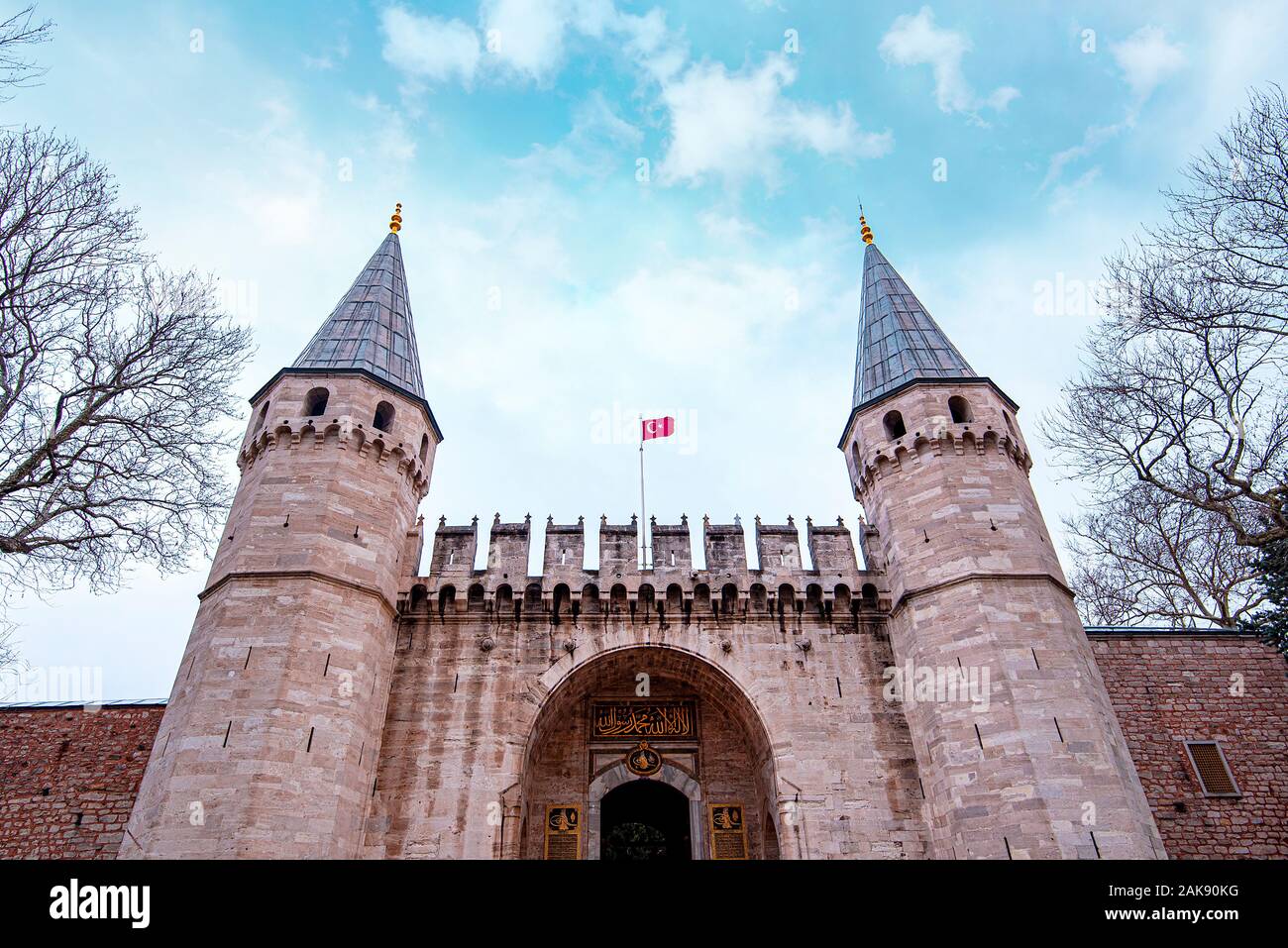 The main Entrance, Gates with Towers and Turkish Flag to Topkapi Palace in Istanbul in Turkey Stock Photo