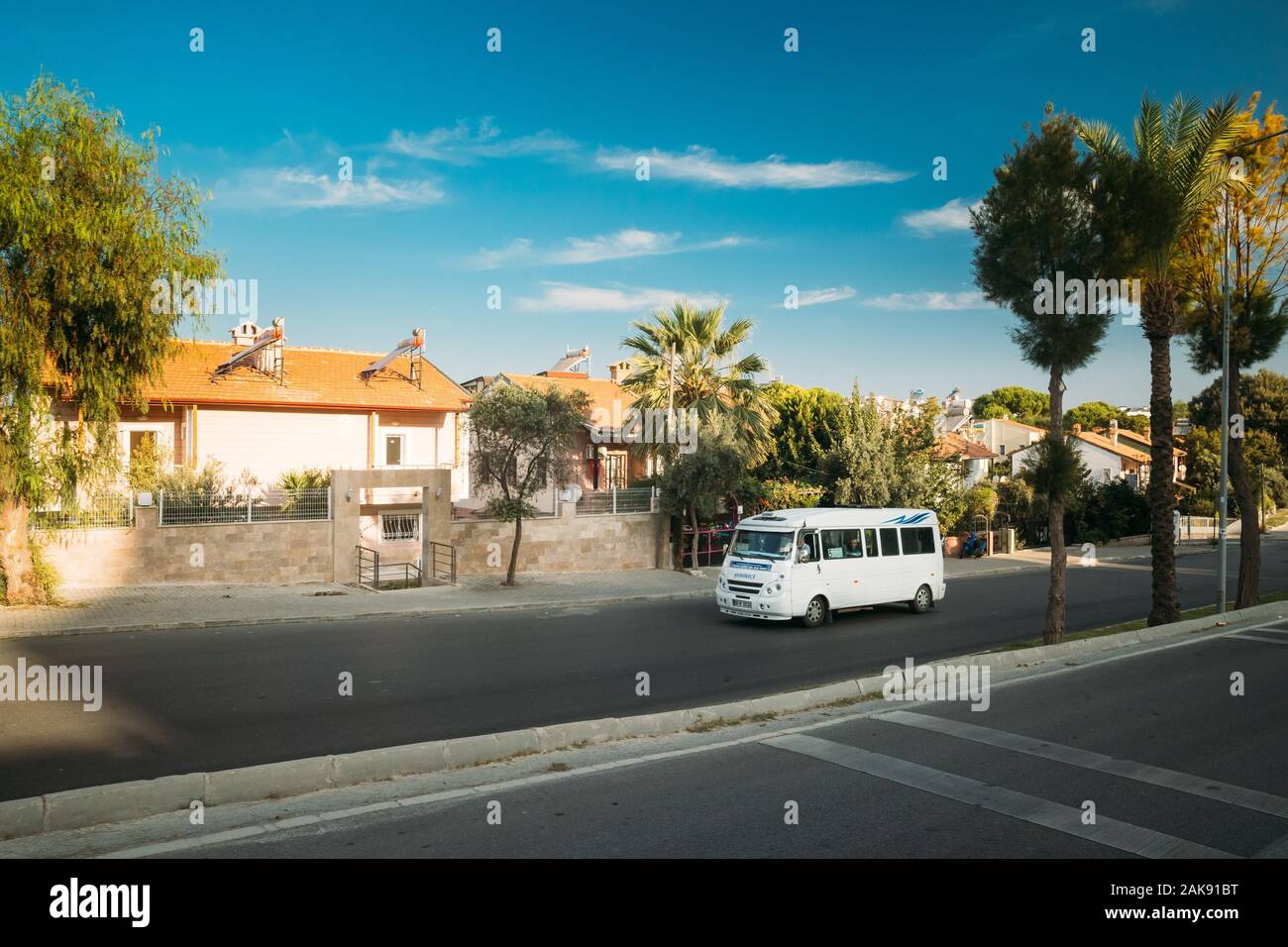 Kusadasi, Ayd n Province, Turkey - September 9, 2019: Urban taxi Minibus driving on street. Stock Photo