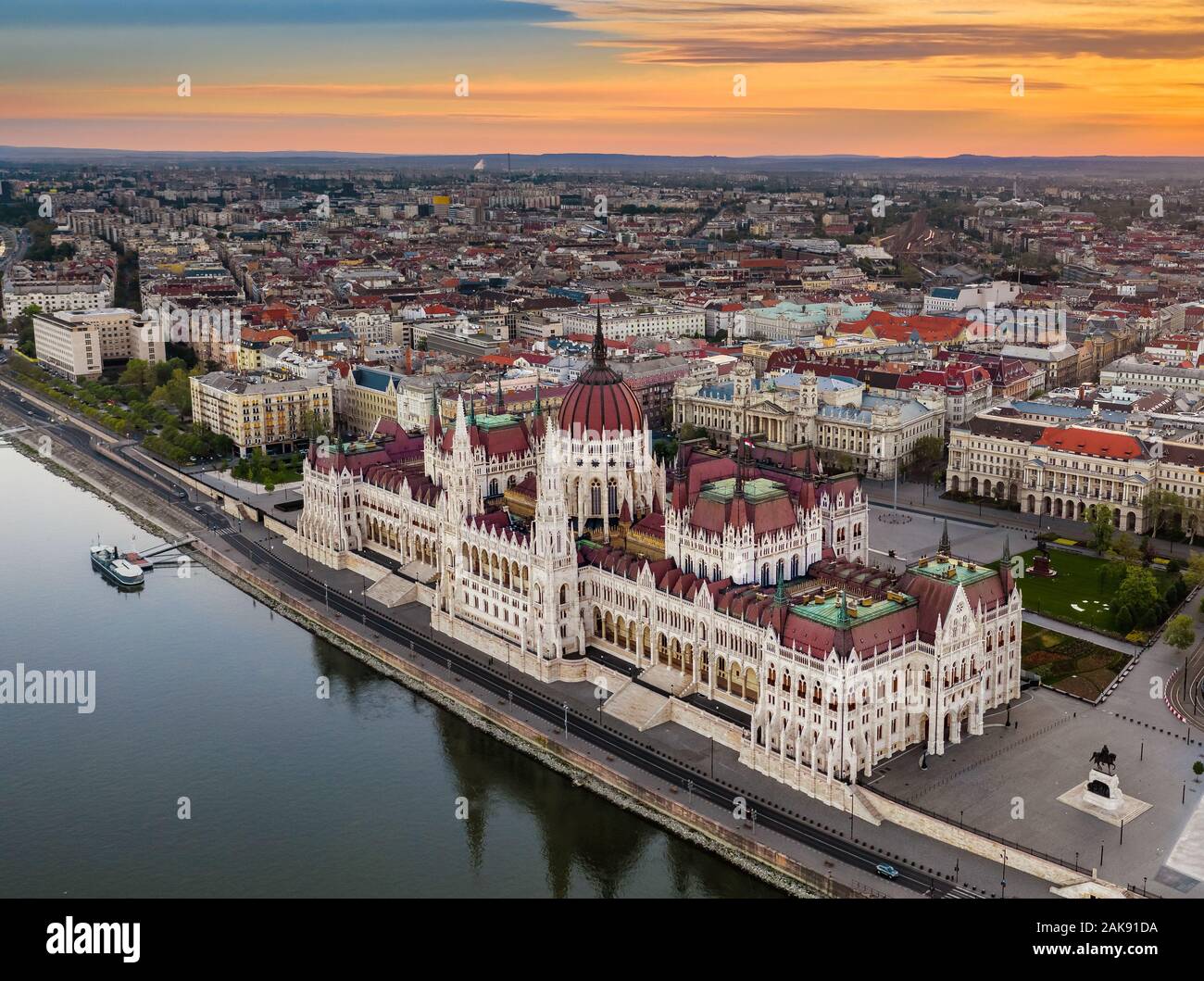 Budapest, Hungary - Aerial drone view of the beautiful Parliament building of Hungary on a calm summer morning with golden clouds and blue sky Stock Photo