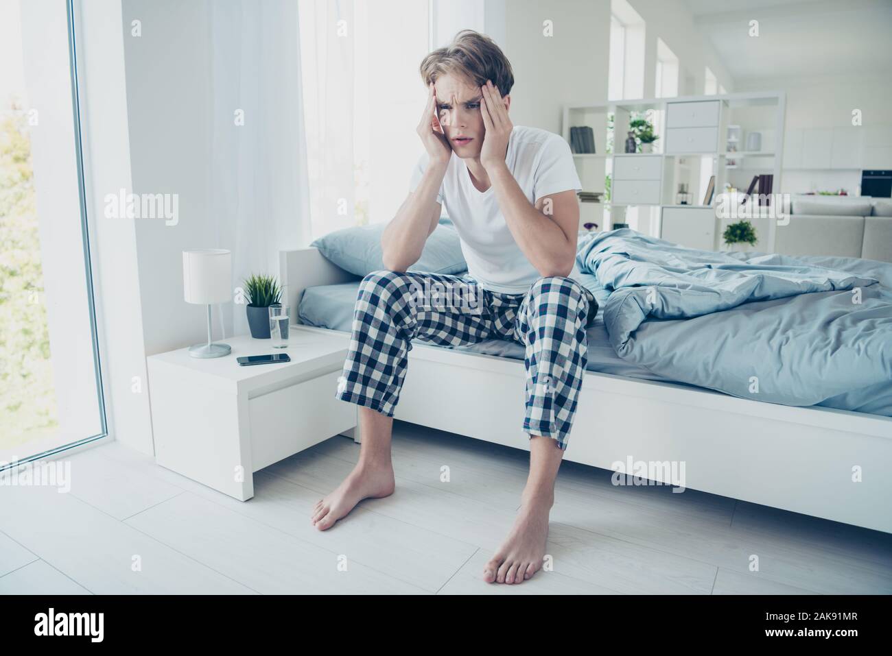 Fulle size photo of frustrated unhappy guy have hangover after hard party suffer terrible