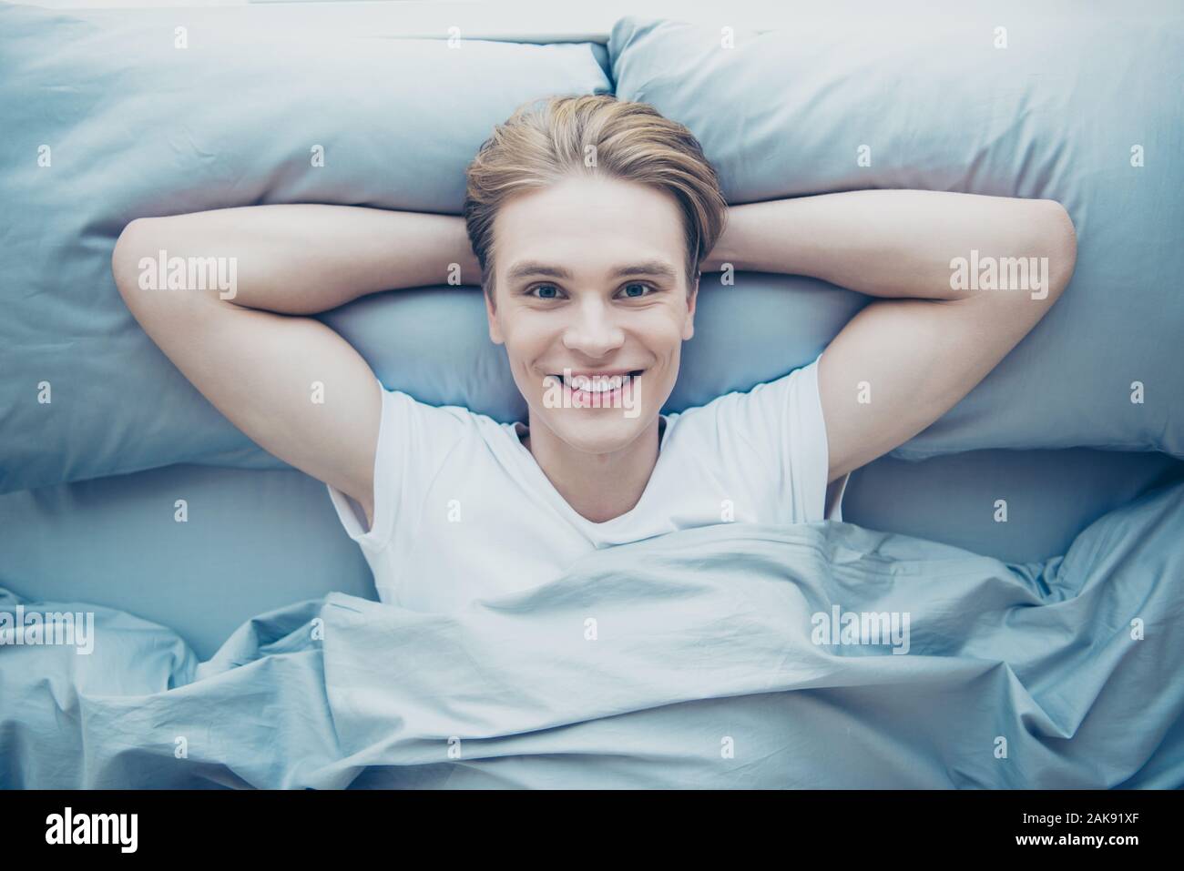 Top High Above Angle Photo Of Positive Cheerful Guy Lying On Bed Feel Cozy Comfort Awake From Healthy Night Sleep In Morning House Indoors Stock Photo Alamy Top High Above Angle Photo Of Positive Cheerful Guy Lying On Bed Feel Cozy Comfort Awake From Healthy Night Sleep In Morning House Indoors Stock Photo Alamy