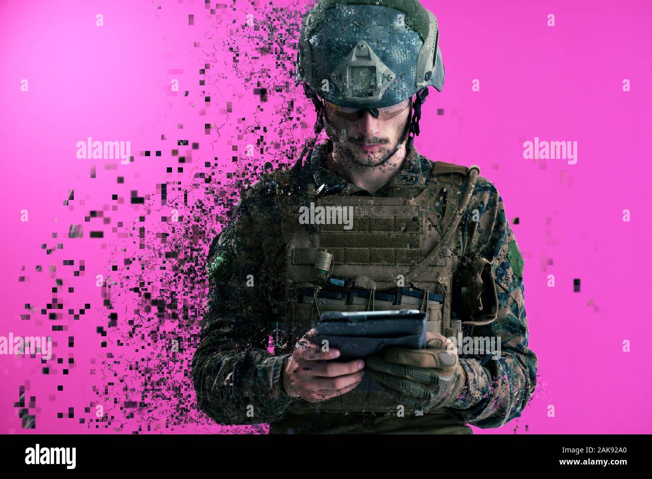 soldier using tablet computer hands closeup pnk background pixelated neural network concept Stock Photo