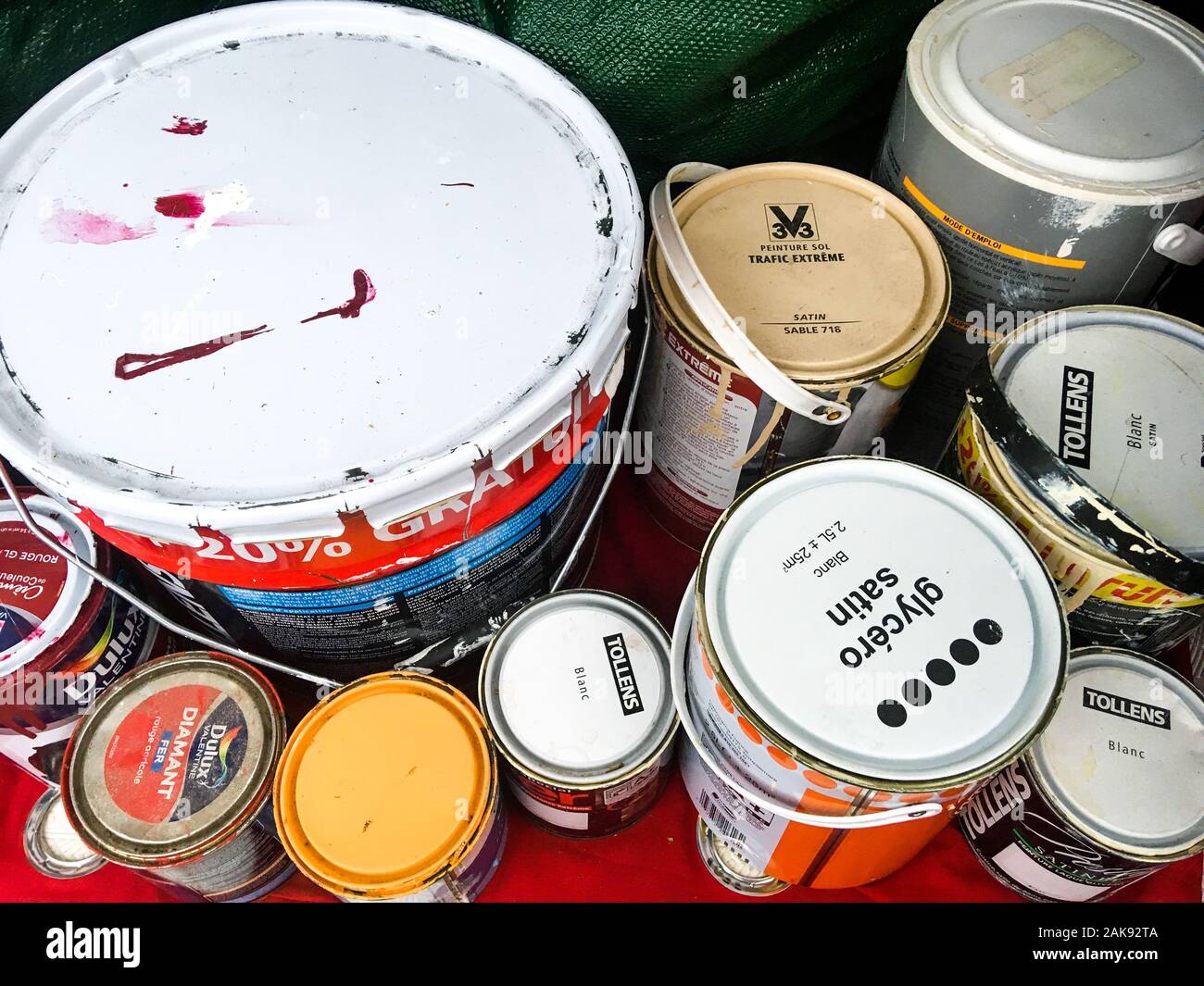 Paint buckets to recycle, stocked in a car trunk, Lyon, France Stock