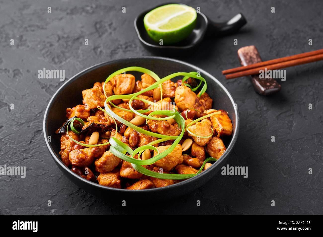 Kung Pao Chicken or Gong Bao Ji Ding at dark slate background. Sichuan