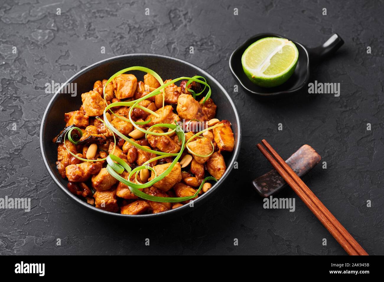 Kung Pao Chicken or Gong Bao Ji Ding at dark slate background. Sichuan