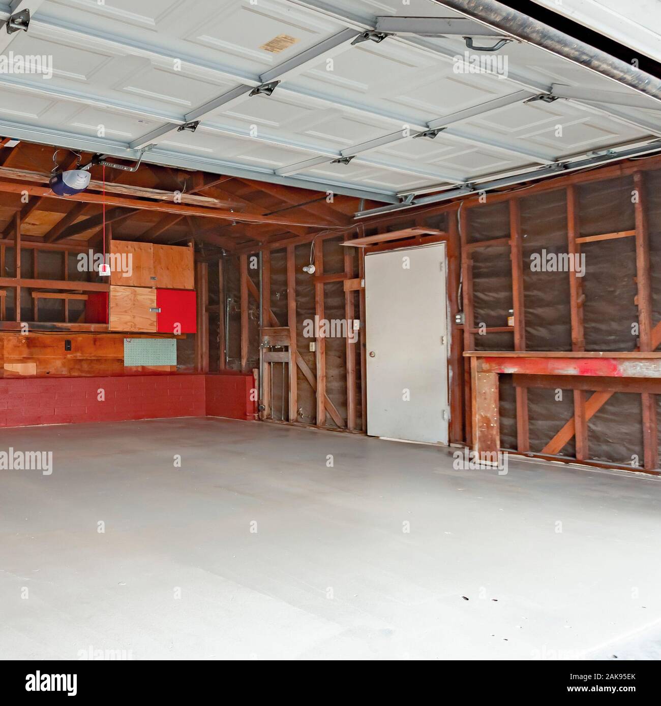 Square Frame Garage Doors Open With A Garage With Wood Support