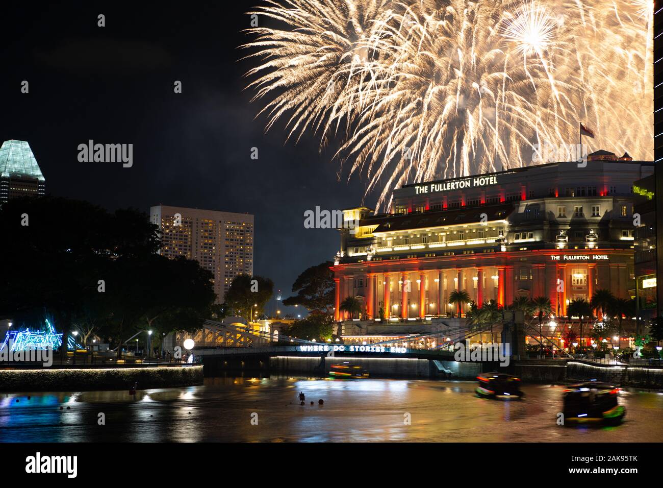 Fireworks explode over The Fullerton Hotel as Singaporeans celebrate Chinese New Year Stock Photo