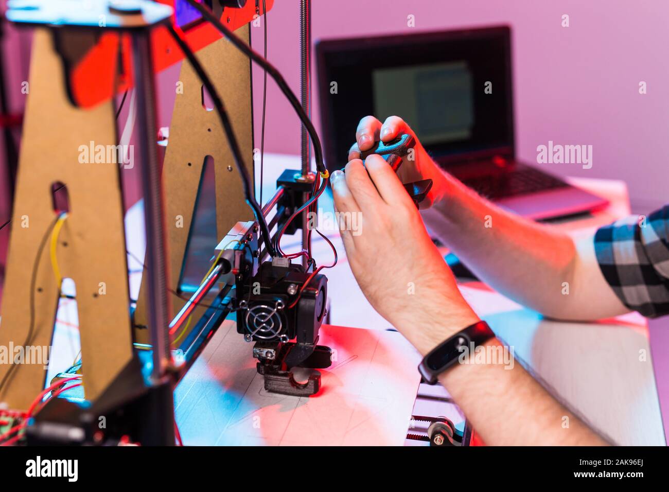 A student man print prototype on 3D printer. Stock Photo