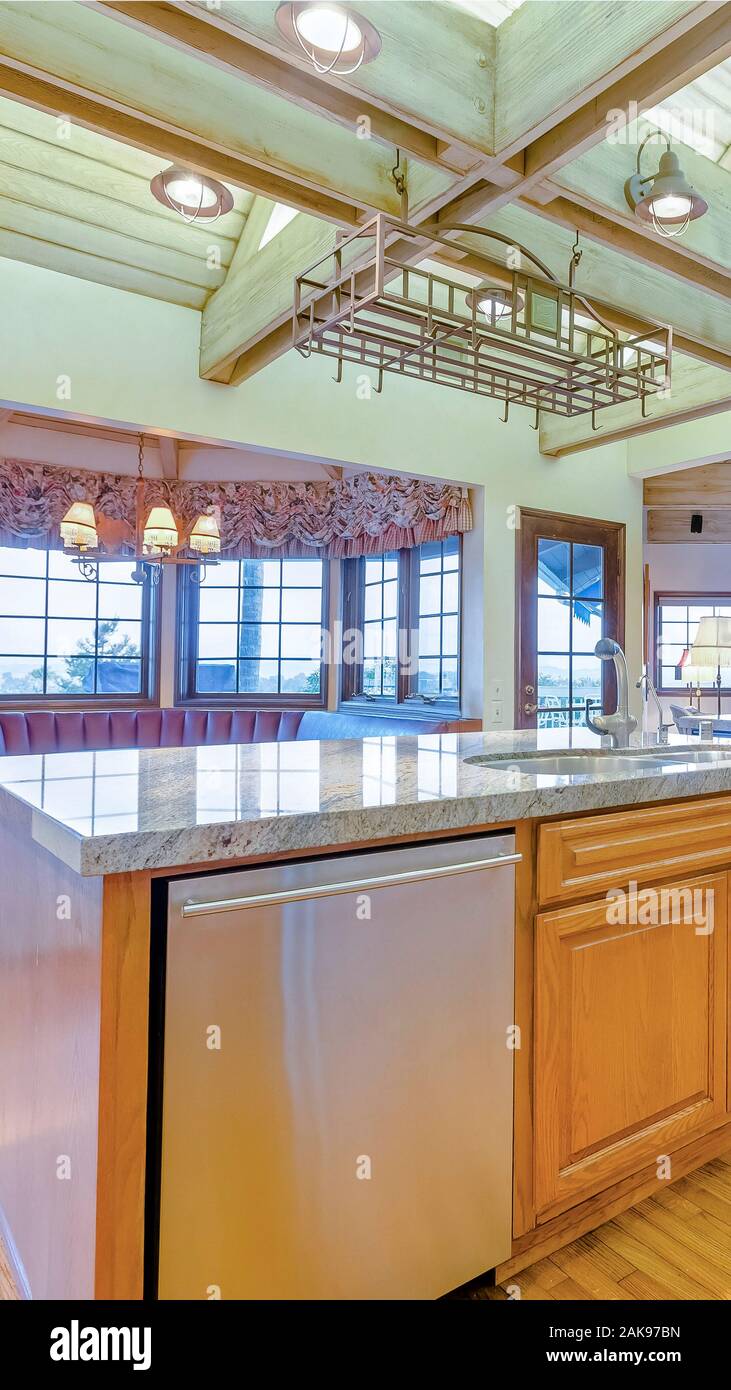Vertical Bright Open Kitchen With Vaulted Ceilings And Wooden