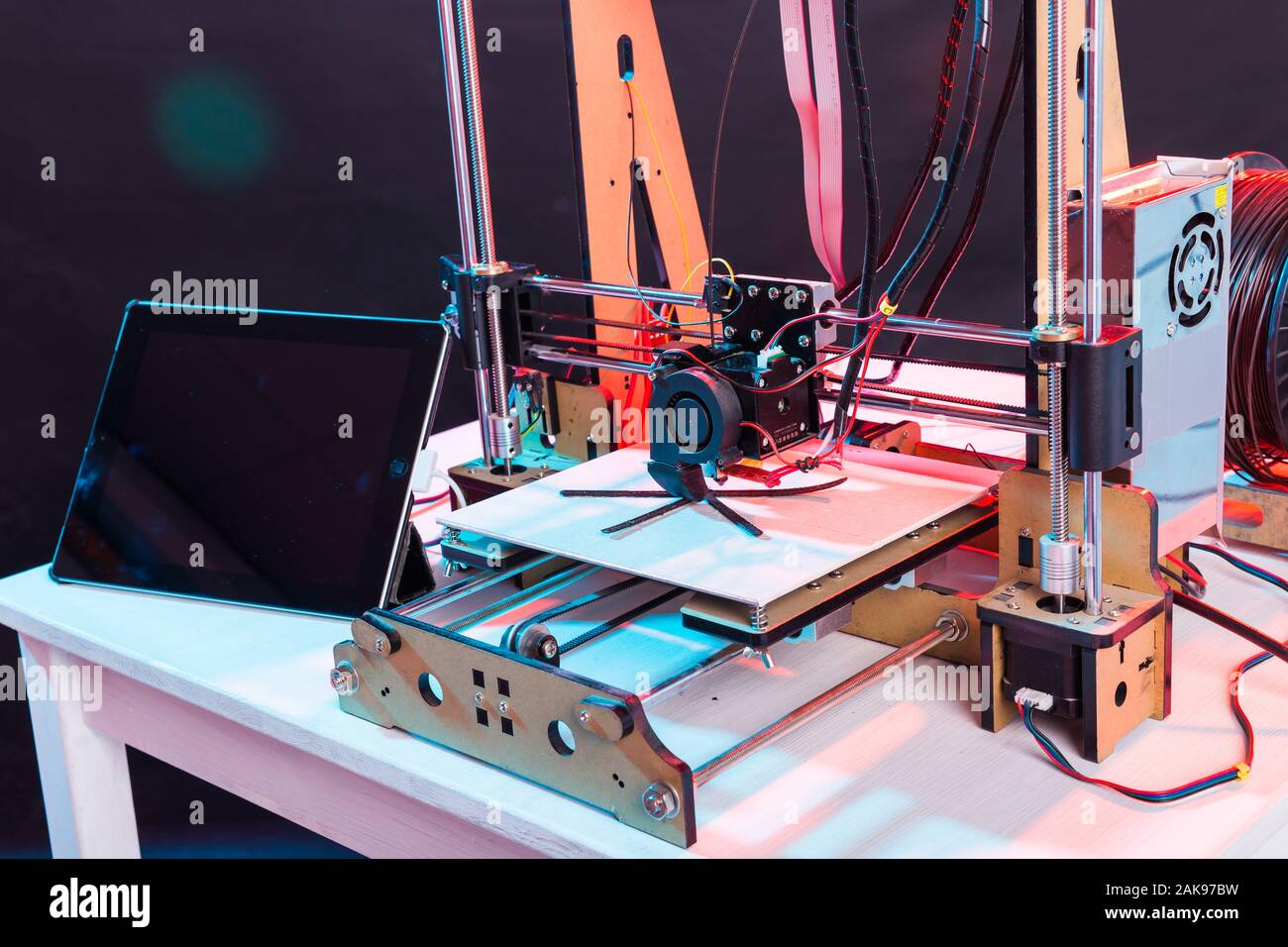 Electronic three dimensional plastic printer during work in school laboratory, 3D printer, 3D printing. Stock Photo