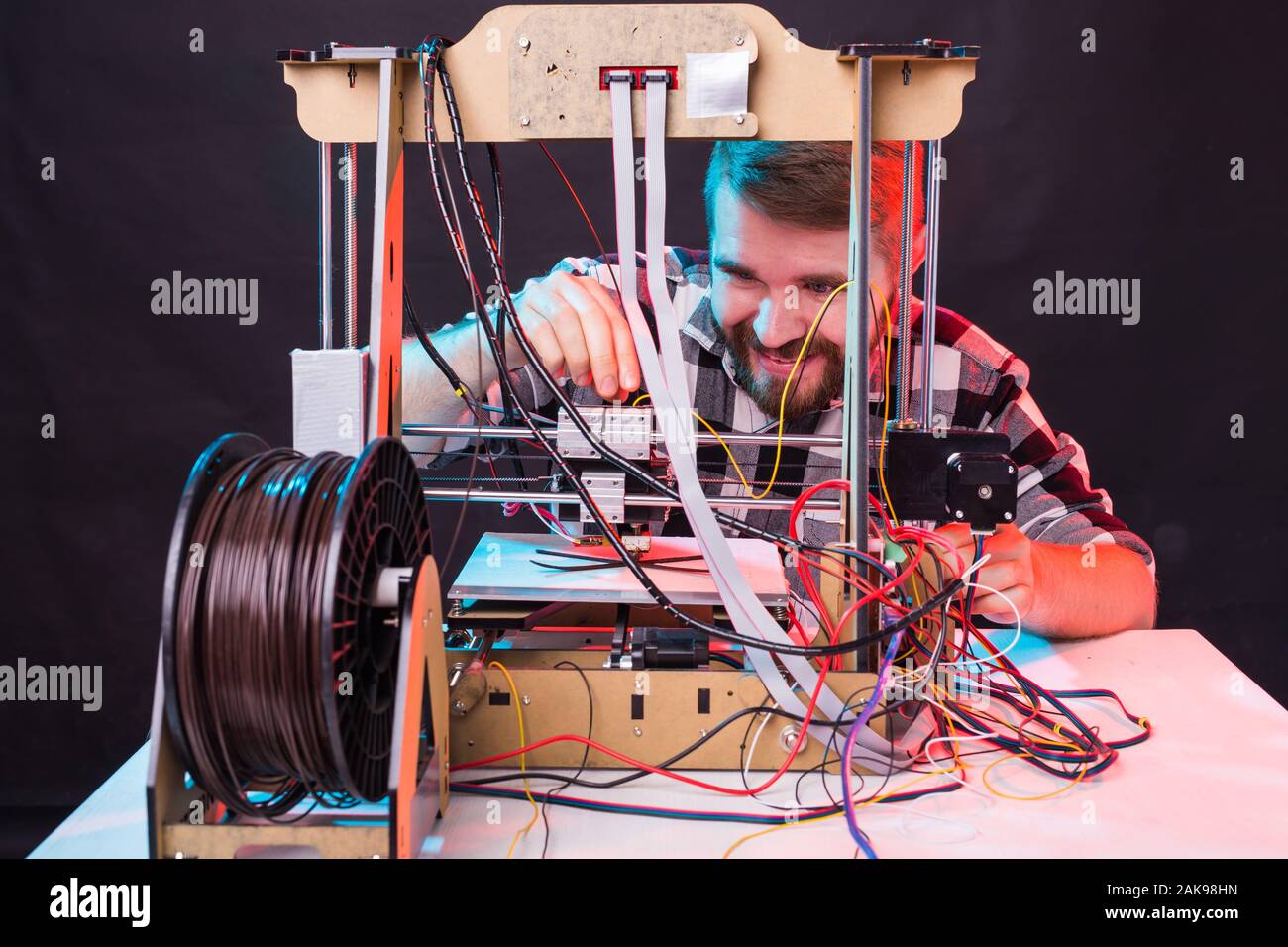 A student man print prototype on 3D printer. Stock Photo