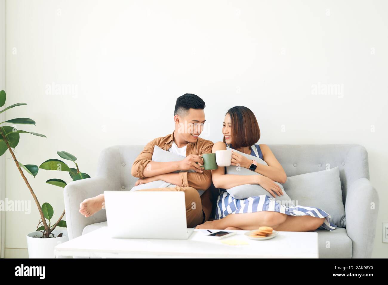 Asian couple hug together in hi-res stock photography and images - Alamy