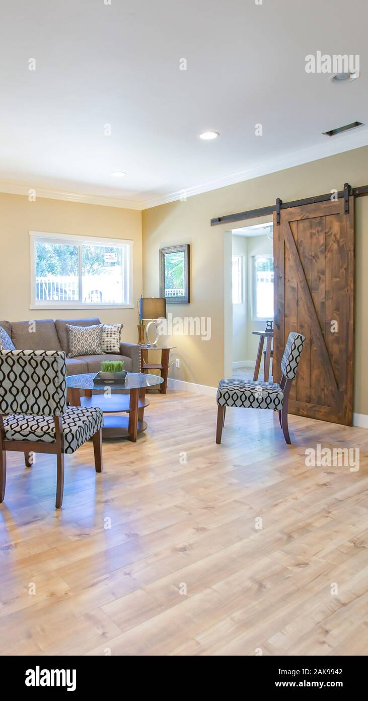 Vertical Living room with wood floors and bamboo plant Stock Photo Alamy