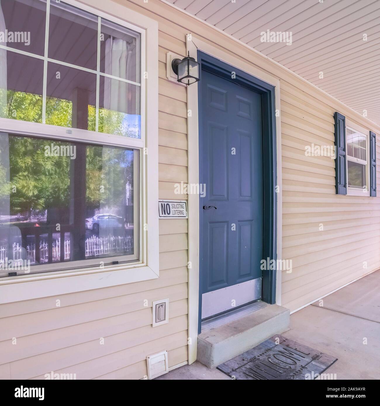 Square frame Covered patio to a white timber house Stock Photo - Alamy