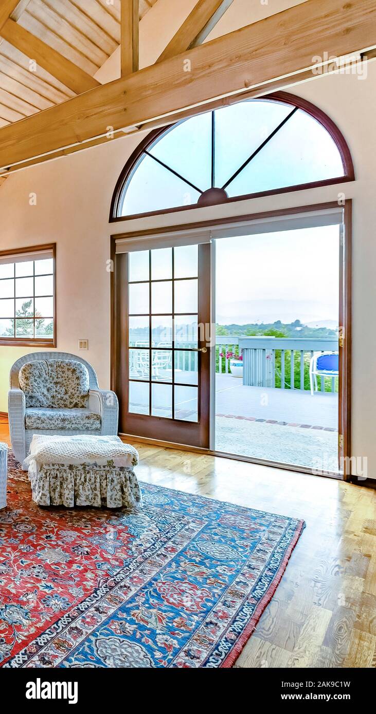 Vertical Bright Open And Warm Living Room With Vaulted Ceilings