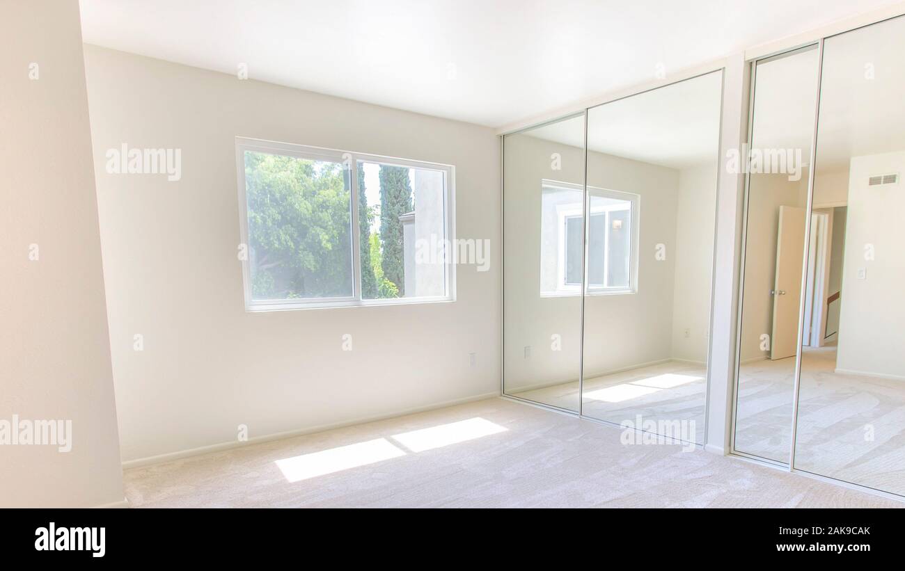 Panorama frame Master bedroom with double closet doors Stock Photo Alamy