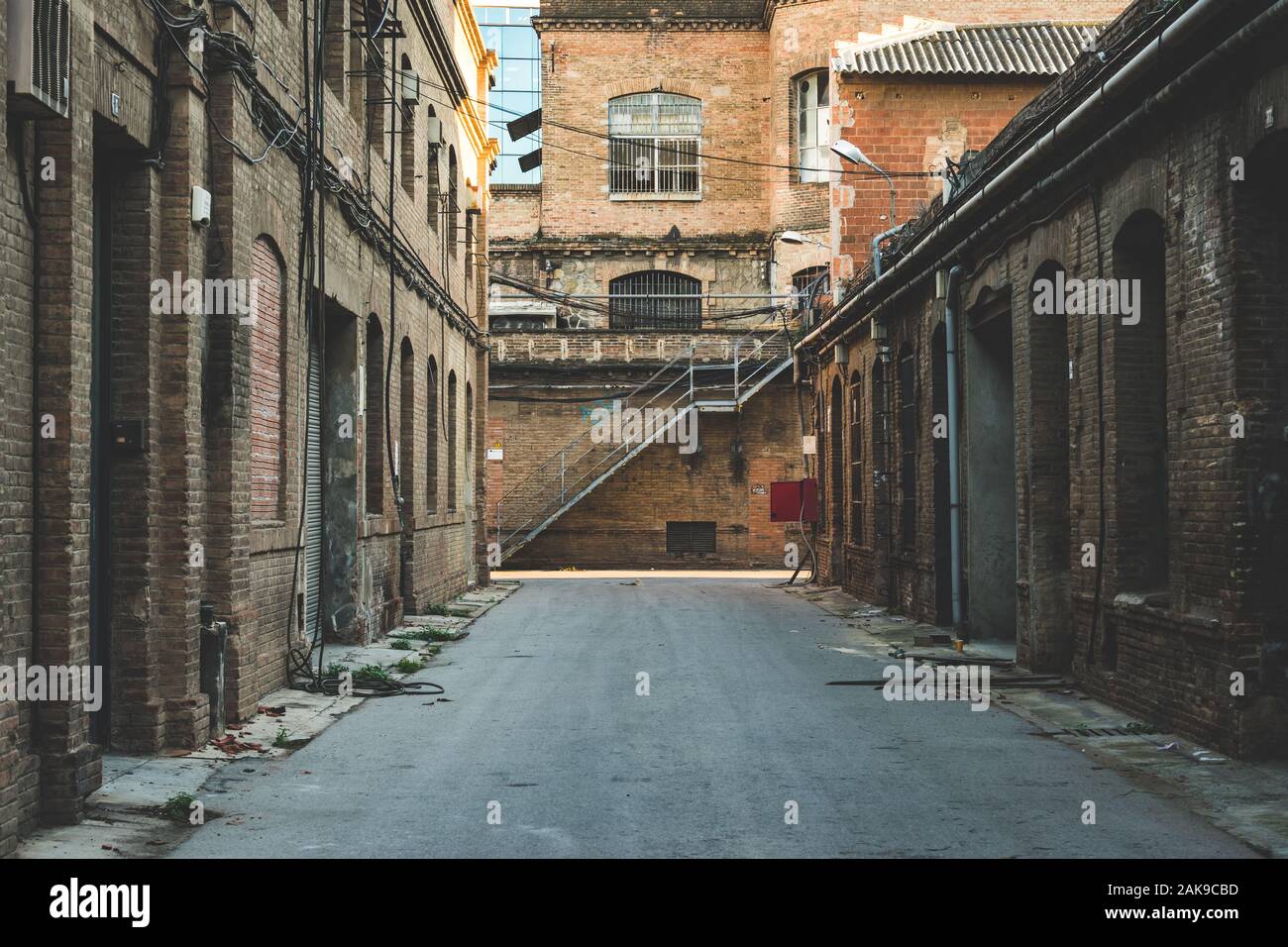 Alley of an old abandoned factory. Stock Photo