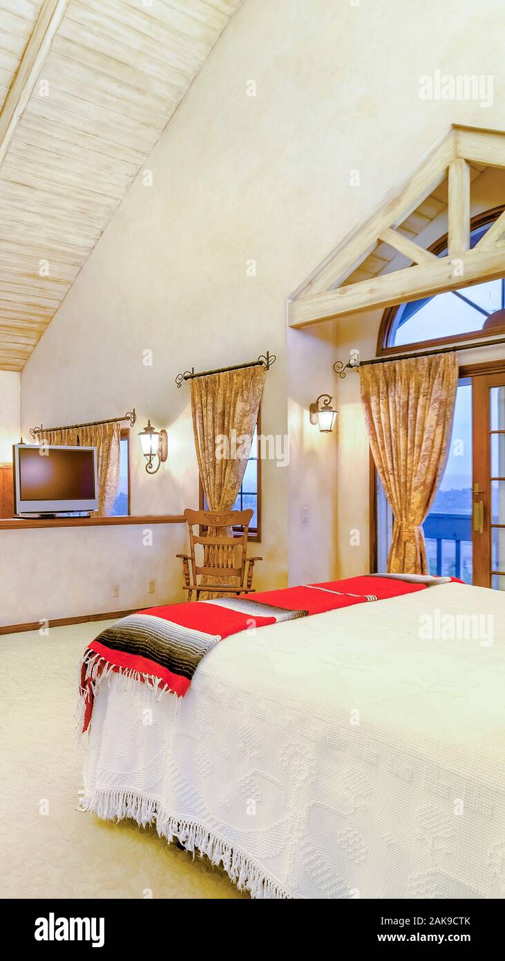 Vertical Frame Bright Open And Warm Master Bedroom With Vaulted