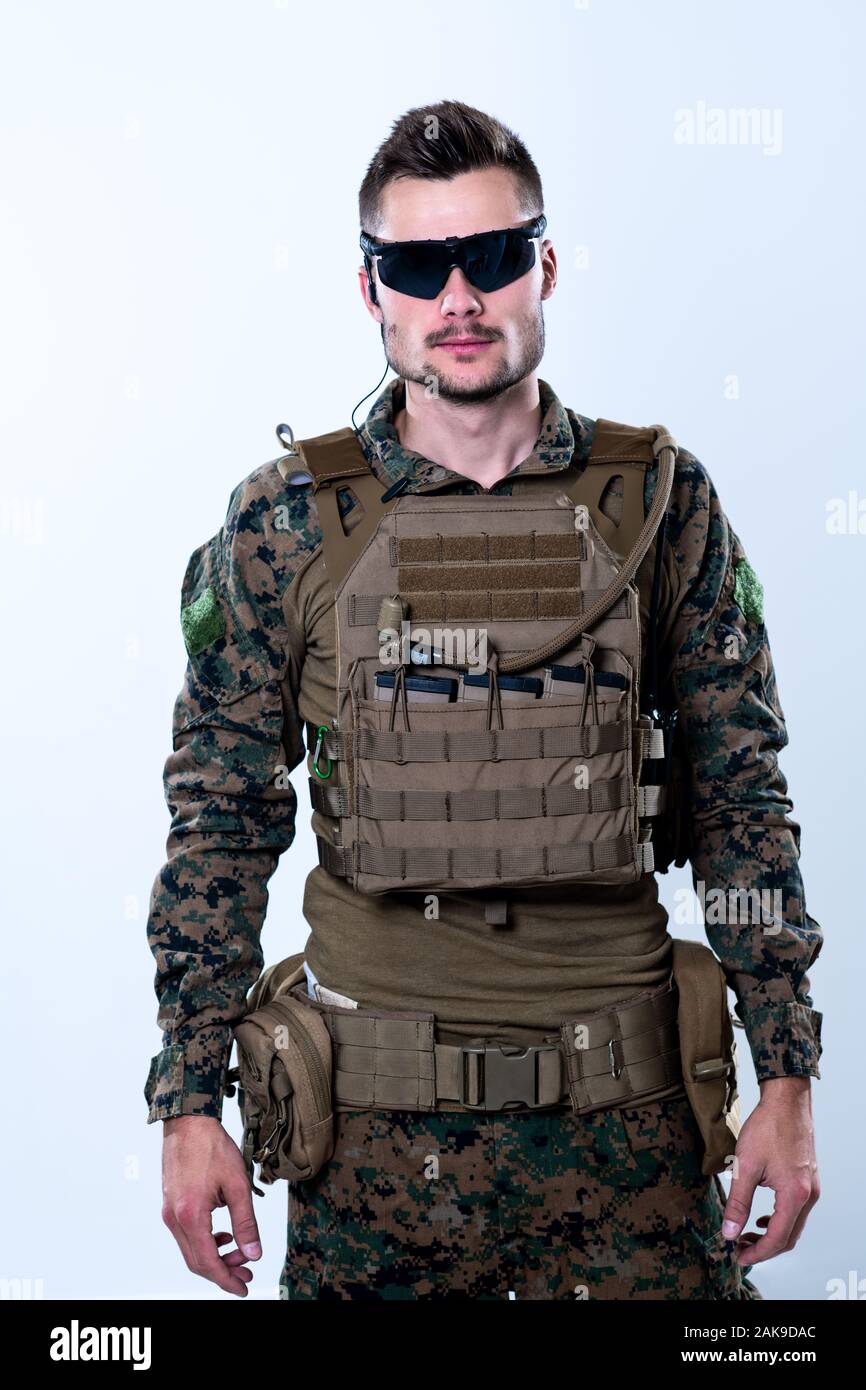 american marine corps special operations soldier with fire arm weapon and  protective army tactical gear clothes Studio shot isolated on white backgro  Stock Photo - Alamy