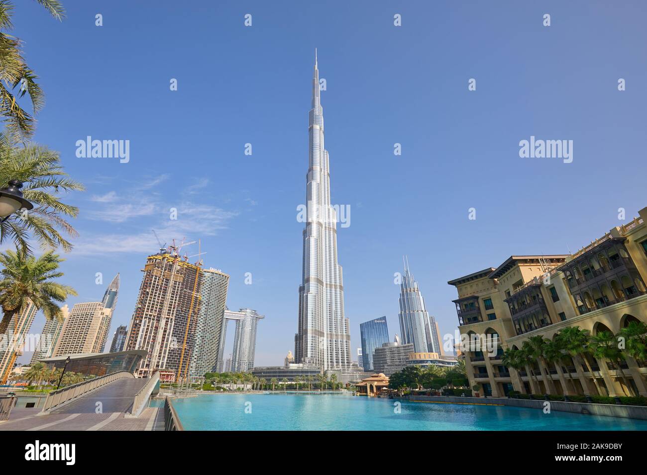 DUBAI, UNITED ARAB EMIRATES - NOVEMBER 19, 2019: Burj Khalifa skyscraper and artificial lake in a sunny morning Stock Photo