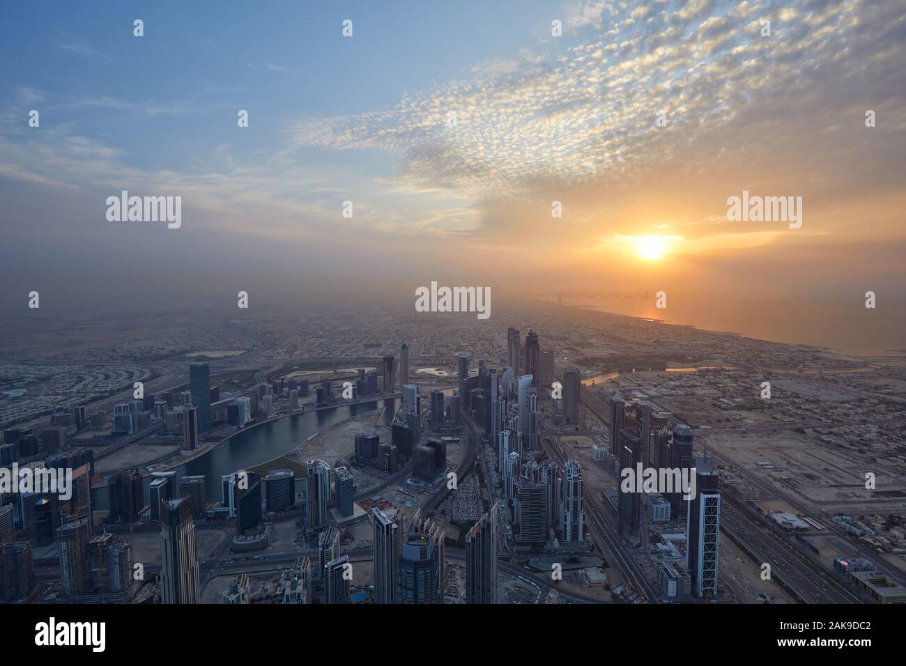 DUBAI, UNITED ARAB EMIRATES - NOVEMBER 19, 2019: Dubai city high angle view with skyscrapers at sunset seen from Burj Khalifa Stock Photo