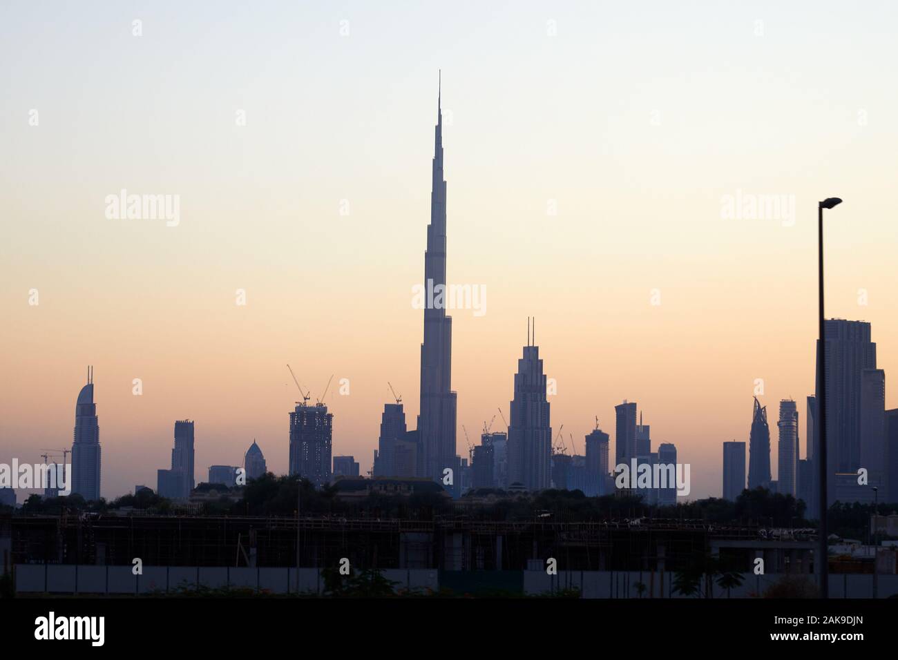 Dubai skyline with Burj Khalifa skyscraper at sunset, clear sky in United Arab Emirates Stock Photo