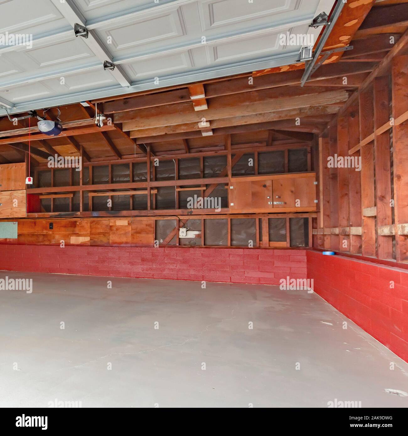 Square Garage Doors Open With A Garage With Wood Support Exposed