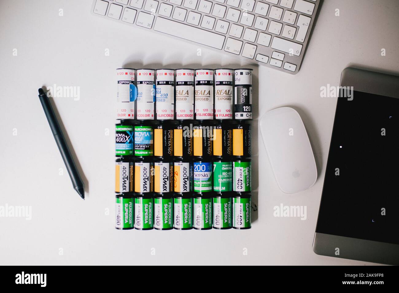 Rolls of 35mm and 120 mm photography film on a desk Stock Photo