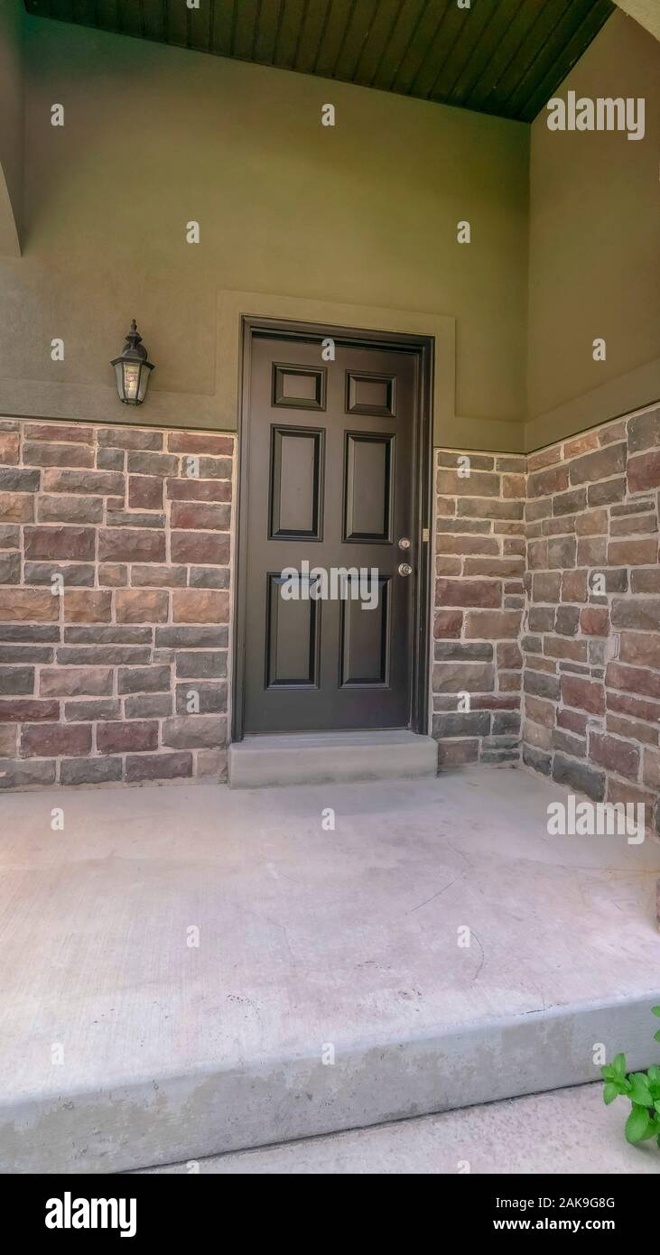 Vertical Home exterior with pillars and railing at the front porch and ...