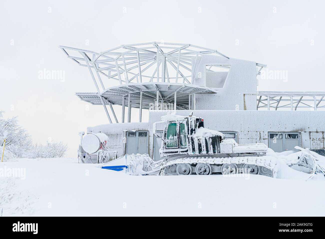 Snow tractor in white winter landscape, edit space Stock Photo