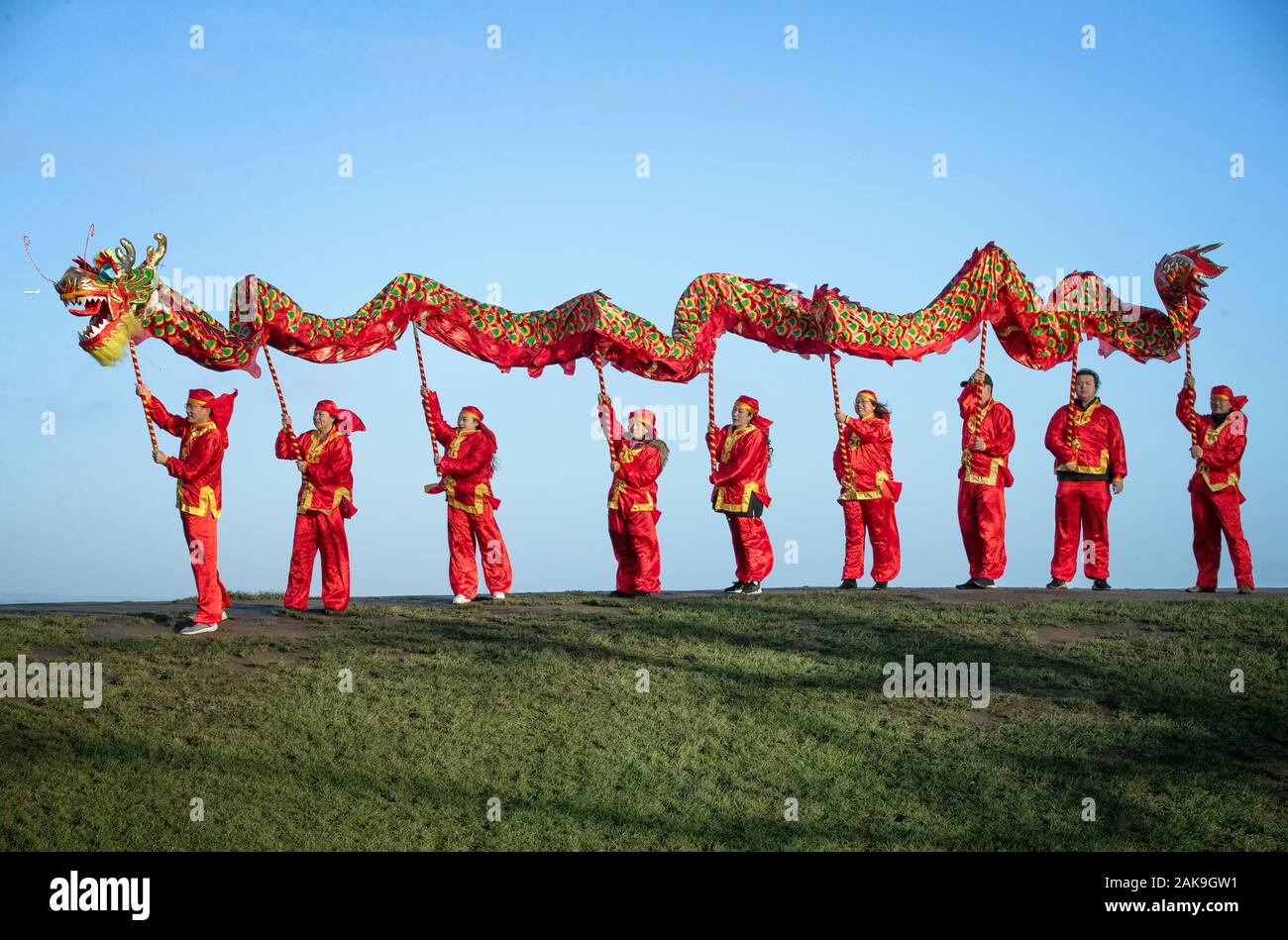 Dancers from the Edinburgh Chinese Education Centre perform a Chinese Dragon dance to launch the 2020 Chinese New Year celebrations and the Year of the Rat on Calton Hill, Edinburgh. Stock Photo